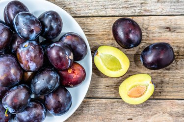 Purple plums, autumn fruits harvest