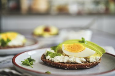 Preparing Avocado Sandwich with Brown Bread, Cottage Cheese and Eggs