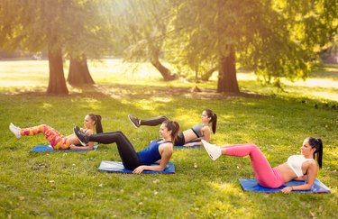 Young Women Exercising In Nature