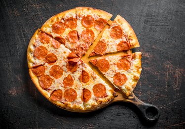 Crispy pepperoni pizza on the cutting Board.