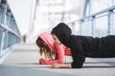 Young women friends working out together