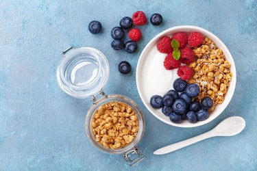 High protein and diet breakfast. Homemade granola with raspberry, blueberry and greek yogurt.