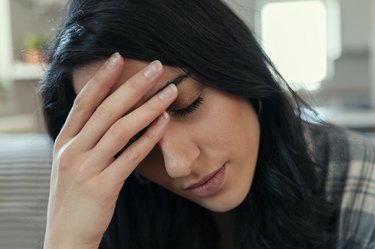 Woman at Home Suffering Migraine