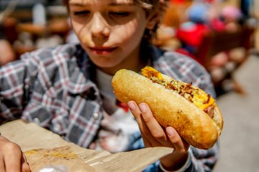 Boy eating gluten-free hot dog