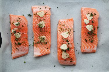 Directly Above Shot Of Salmon Steaks On Paper