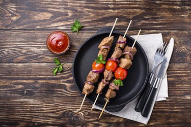 Grilled shish kebab skewers  with tomatoes