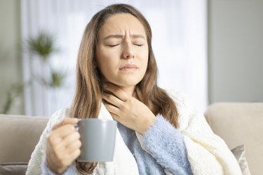 Young woman suffering from cold