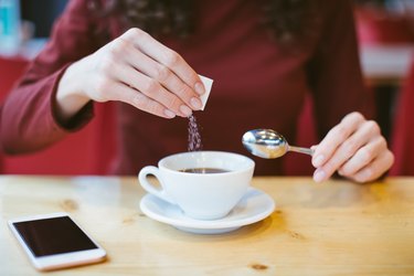 Woman using stevia sweetener