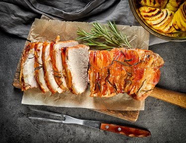 roasted pork on dark gray table