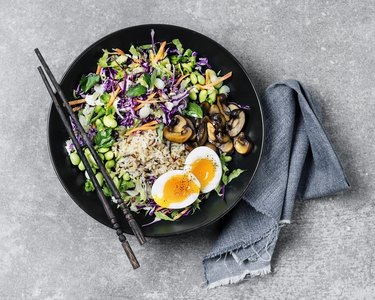 Fresh salad with fried rice and boiled eggs
