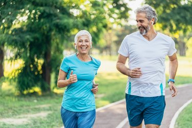 Senior couple power walking on a track