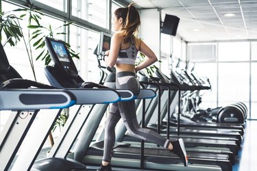Fitness woman doing a cardio session on a treadmill
