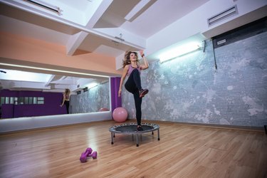 Girl training on trampoline