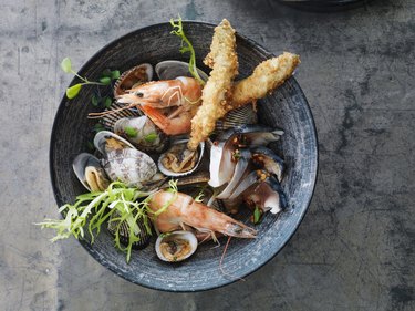 Seafood in a bowl on a metallic surface