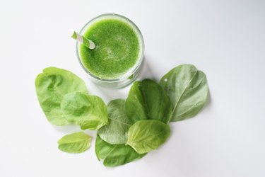 glass of fresh green spinach healthy smoothie