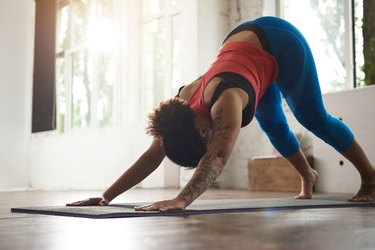 Woman with curly hair doing yoga