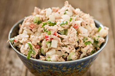Tuna Salad in a bowl on a wooden table