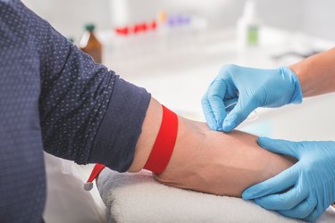 Man having blood collecting in hospital