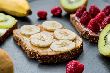 what to eat before a workout toasts with raspberries, bananas and kiwi. Healthy lifestyle