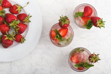 Iced cold drink with fresh strawberry