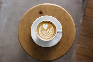 View of coffee cup with latte art straight from above