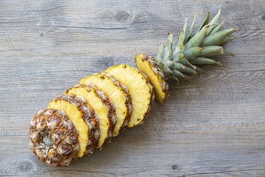 Sliced Pineapple on Wooden Background