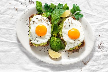 Top view healthy avocado toasts breakfast lunch avocado toast fried eggs white background