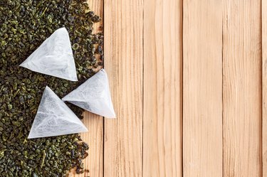 Tea in bags on the dried leaves of tea