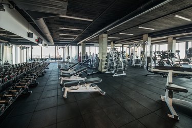 Gym without people with large group of exercise machines.