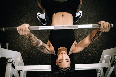 Strong and Fit Woman Working Out in Gym