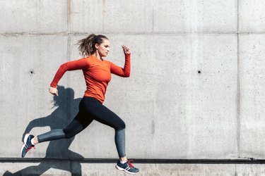 young sportswoman running outdoors