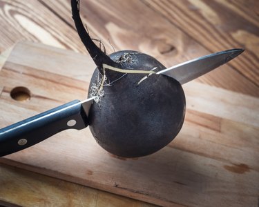 Fresh radish cut with a kitchen knife