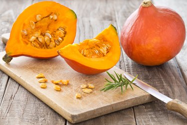 Sliced hokkaido pumpkin on a wooden board