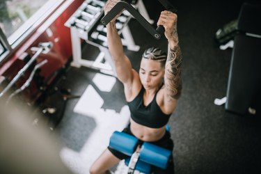 Strong and Fit Woman Working Out in Gym