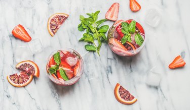 Orange and strawberry summer Sangria with fresh mint leaves