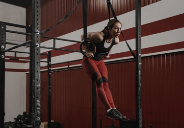 Woman performing a CrossFit muscle-up exercise