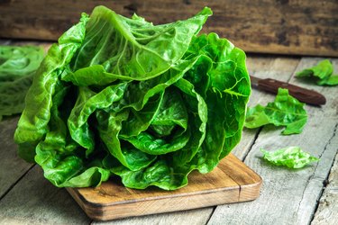 green butter lettuce head on wood