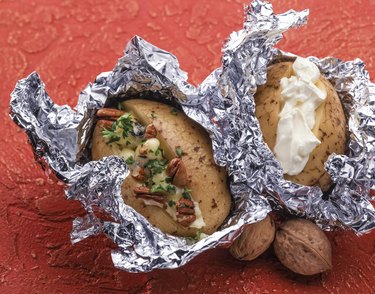 Baked potato with sea salt and walnuts and sour cream.