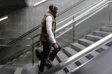 A person who climbs the stairs of a subway station to demonstrate the benefits of climbing the stairs.