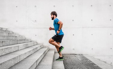fit man running up a flight of stairs
