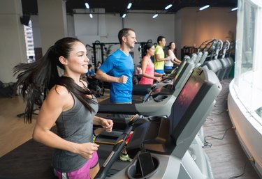 Athletic people working out at the gym