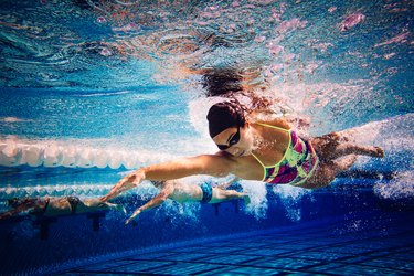 Swimmers doing freestyle in lane