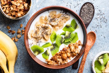 Tropical fruit bowl with granola and yogurt