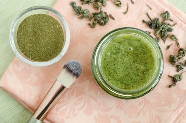 Homemade natural mask (scrub) with sea salt, olive oil and green tea. Diy cosmetics recipe. Top view, copy space