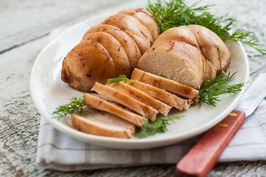 chopped meat fillet baked with herbs on a plate