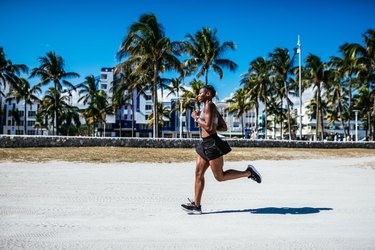 Puertorican woman jogging in the morning near the beach in USA