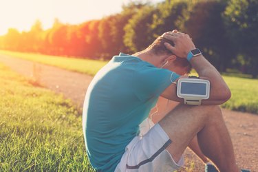 Upset man in the park after bad running results