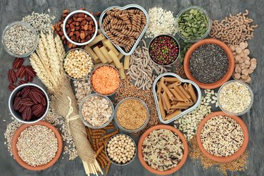 Top view of a table spread with healthy, whole-wheat and whole-grain carbohydrate foods