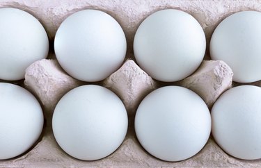 Shot of blue eggs in carton.