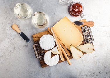 Savory dessert. Cheese platter served with dessert wine, jam and pear